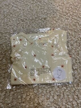 Cream Ribbed Baby Onesie with Peach Floral Print